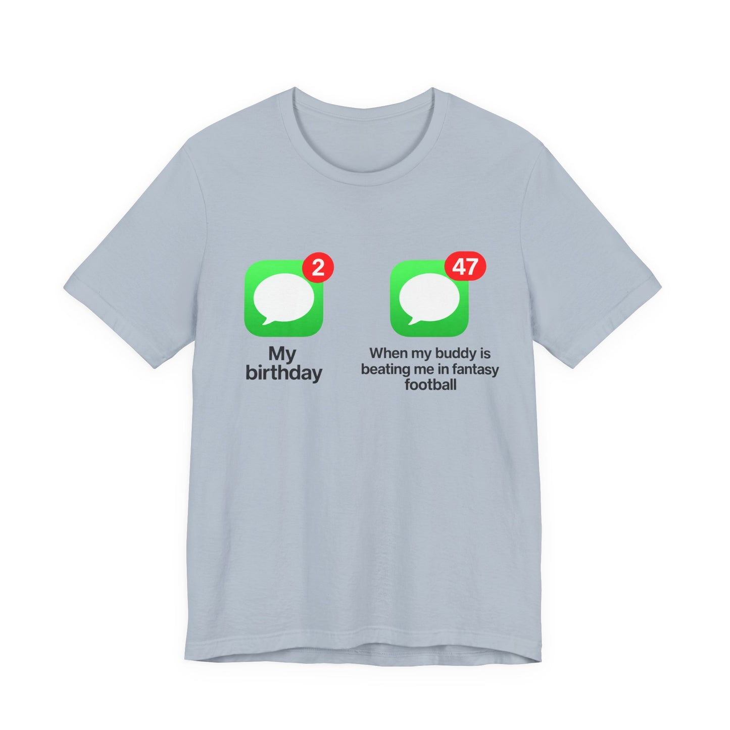Light Blue Bella+Canvas 3001 t-shirt printed across the chest with two green rounded-square icons, each holding a white speech bubble and a red notification badge, the left badge reading 2 above the caption My birthday and the right badge reading 47 above the caption When my buddy is beating me in fantasy football, in bold black lettering.
