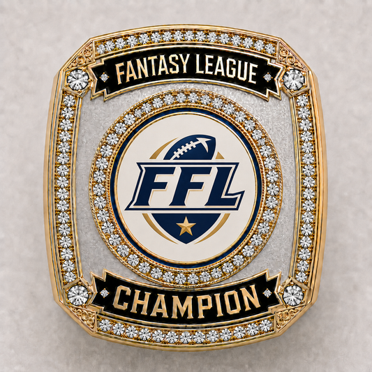 Custom League Champion Ring, face view. Two tone gold and silver ring with a stone set bezel and black enamel banners, the center medallion carrying a full color league shield where your league's own art goes.